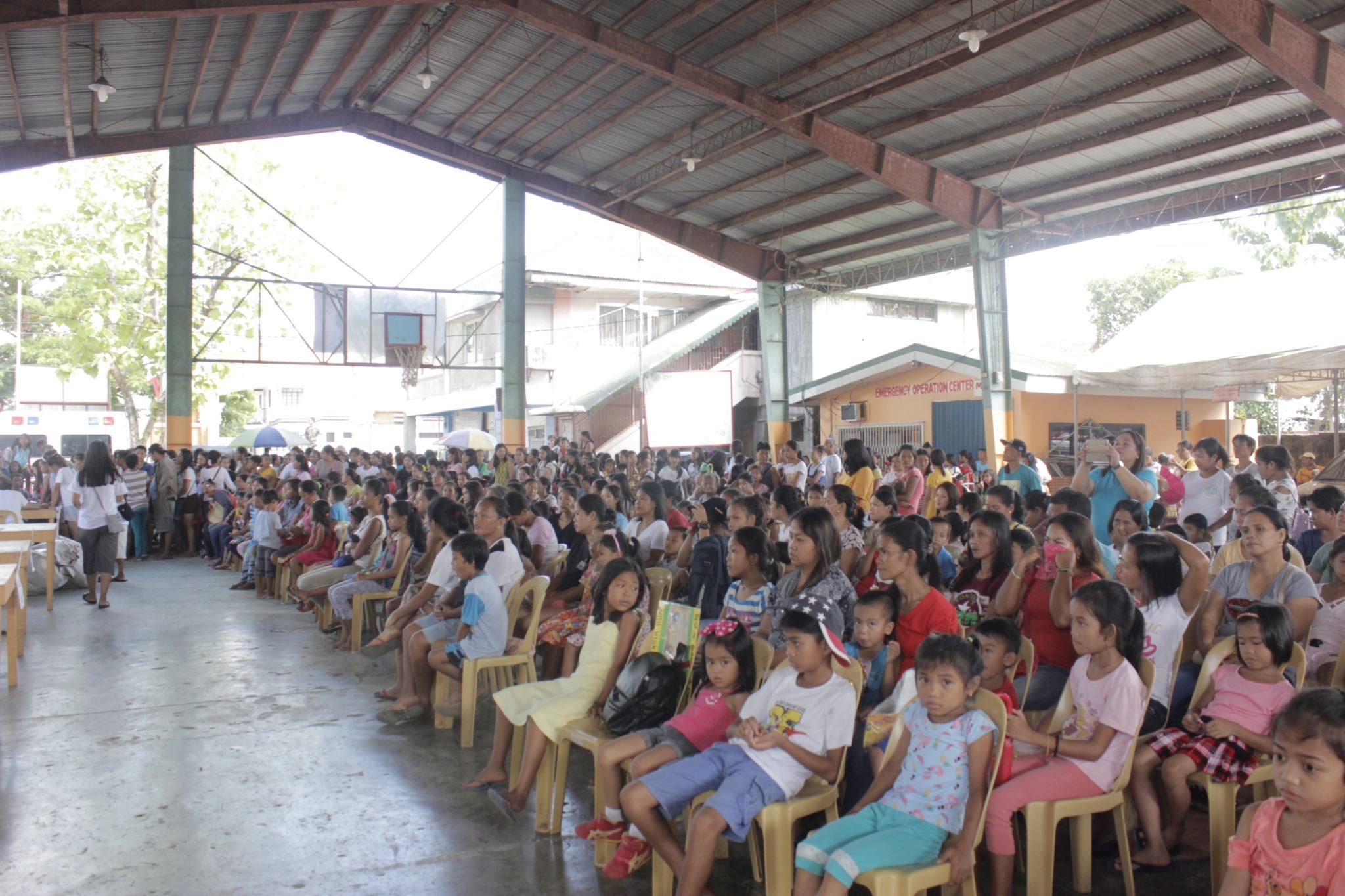 Community attendees seated during the outreach program